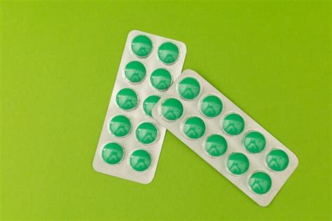 Premium Photo Green Pills On A Green Background Monochrome