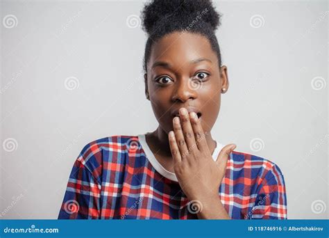 Close Up Portrait Of Beautiful Yawning African Woman Stock Photo