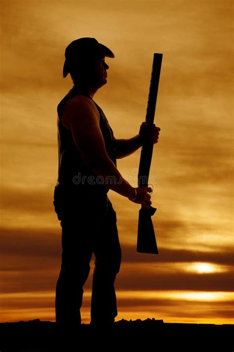 Silhouette Of Cowboy With Shotgun Out In Sunset Stock Image Image Of