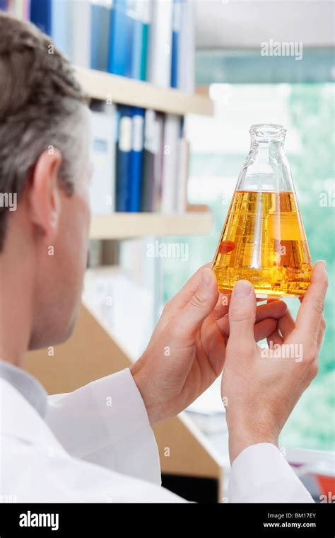 Doctor Holding A Conical Flask In A Laboratory Stock Photo Alamy