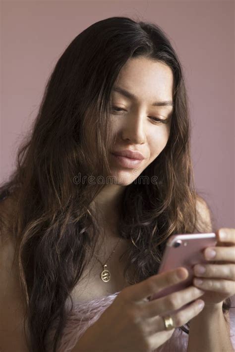 Brunette Girl With A Mobile Phone In His Hands Stock Photo Image Of