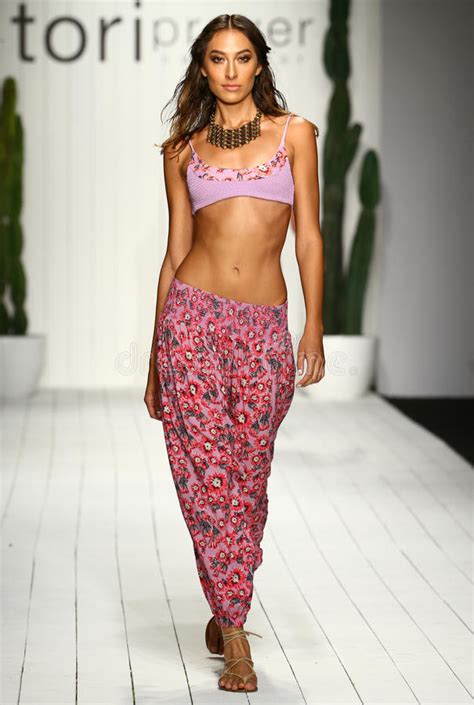 A Model Walks Runway In Designer Swim Apparel During The Tori Praver