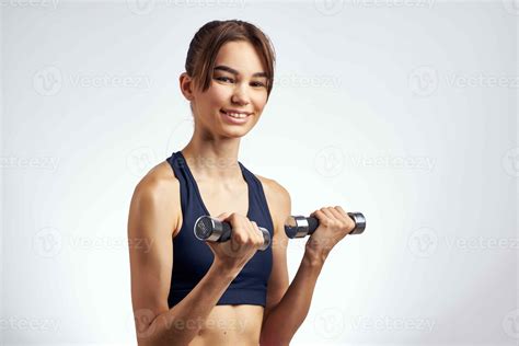 Brunette With A Slim Figure Sports Uniform Dumbbells Gym 22332737 Stock Photo At Vecteezy