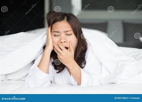 Sleepy Asian Woman Yawning In Bed Stock Image Image Of Young White