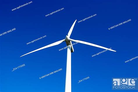 Scandinavian Windturbine Against Blue Sky Stock Photo Picture And