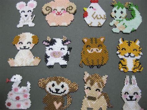 Image result for brick stitch animals | Brick stitch earrings, Beaded animals, Bead weaving