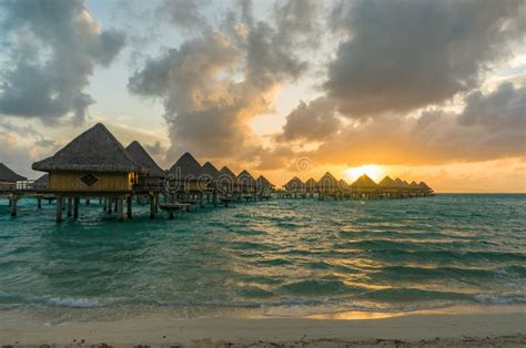 Sunset in a Beach in Bora Bora Stock Photo - Image of aqua, honeymoon ...