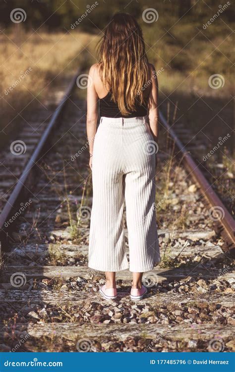 Old Fashioned Style Photography Back View Of Of A Woman Standing On