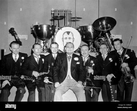 Paul Whiteman (center) with members of his orchestra, 1945 Stock Photo ...