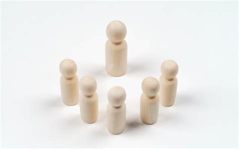 Premium Photo Wooden Peg Dolls On White Background Teamwork