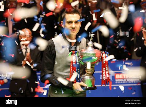 Mark Selby Celebrates With The Trophy After Beating Ding Junhui In The