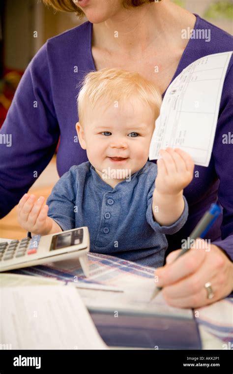 Young Boy Sitting In Mothers Lap Stock Photo Alamy