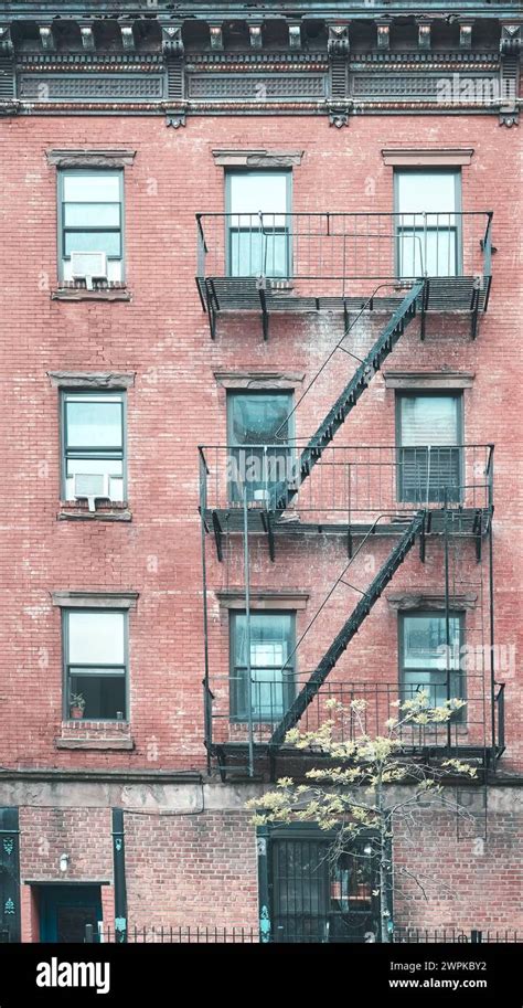 Old Red Brick Building With Fire Escapes Color Toning Applied New