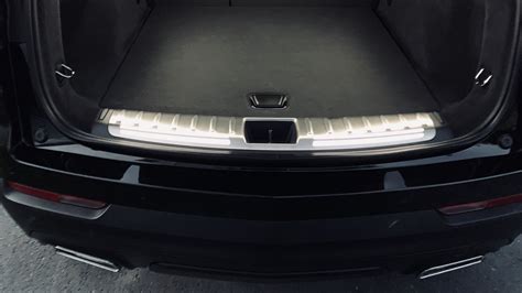 Illuminated Cargo Sill Plate With Premium Carpet Cargo Mat Cadillac