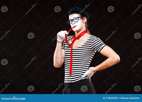 Portrait Of Male Mime Artist Performing Isolated On Black Background