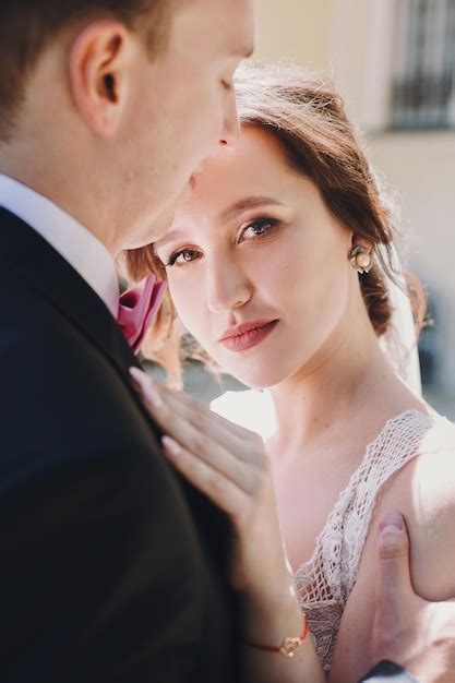 Premium Photo Gorgeous Bride And Stylish Groom Gently Hugging And