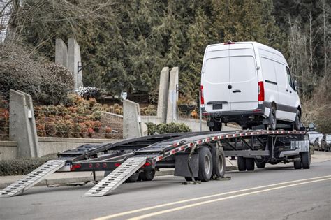 Powerful Truck Unloaded Cargo Mini Van Delivered On The Car Hauler Semi