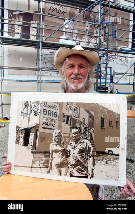 Mural artist Art Mortimer working on the restoration of his mural at ...