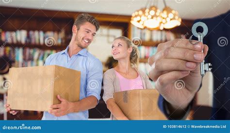 People Moving Boxes into New Home with Key Stock Photo - Image of ...