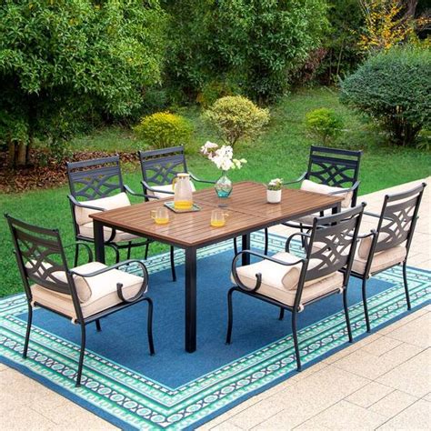 Phi Villa 7 Piece Metal Outdoor Dining Set With Brown Rectangular Table Top And Cast Iron