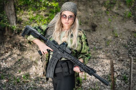 Attractive Female Soldier Hold Rifle Machine Gun Woman With Weapon