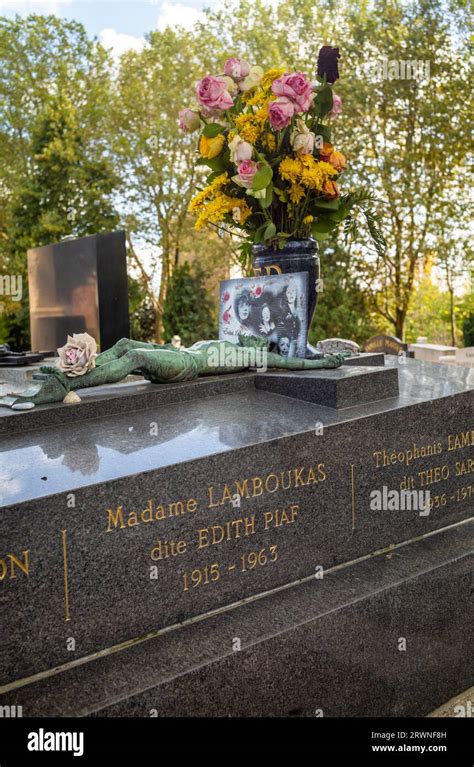 Flowers And Photos Placed On The Grave Of The Famous Singer Edith Piaf