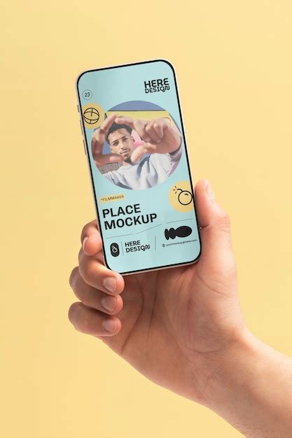 Premium PSD Hand Holding Smartphone Mockup