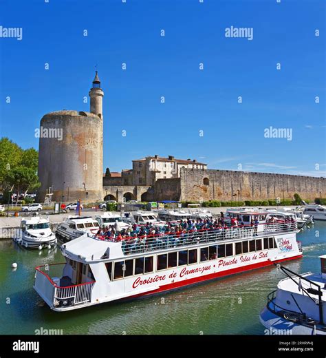 Excursion Boat In Front Of The Tour De Constance Fortified Tower And