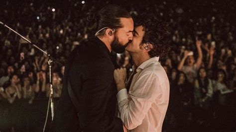 Matty Healy Of The 1975 Kisses His Bandmate Ross Macdonald Onstage