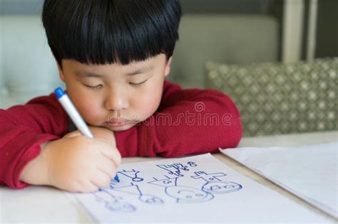 A Asian Boy is Drawing a Picture. Stock Photo - Image of mother, paper: 112187608