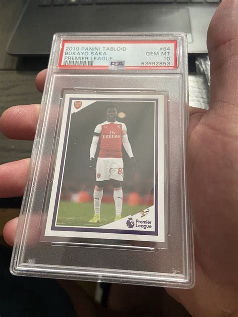 2019 Panini Tabloid 64 Bukayo Saka Rookie Sticker RC P