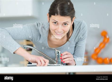 Female Plumber Installing A Sink Stock Photo Alamy