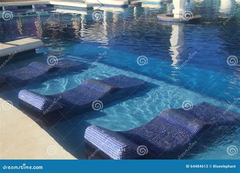 Hotel resort swimming pool stock image. Image of relax - 64484613