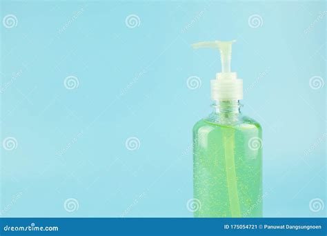 Wash Hand Sanitizer Gel Bottle On Blue Background Against Novel