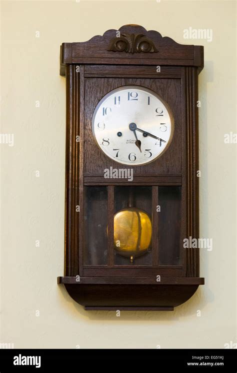 Antique Wall Mounted Pendulum Clock Stock Photo Alamy