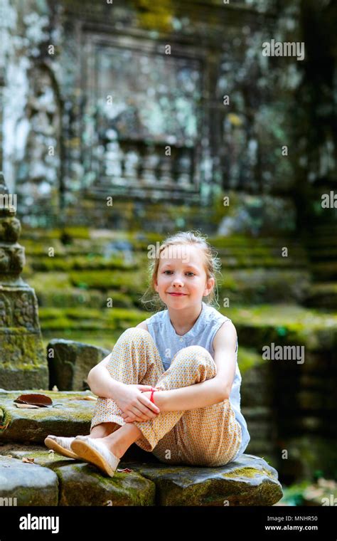 Little Girl In Ancient Angkor Wat Temple In Siem Reap Cambodia Stock