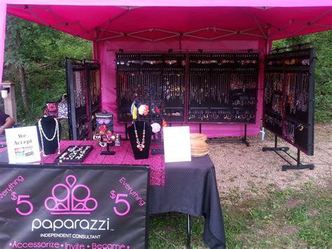 a pink tent set up with jewelry on display