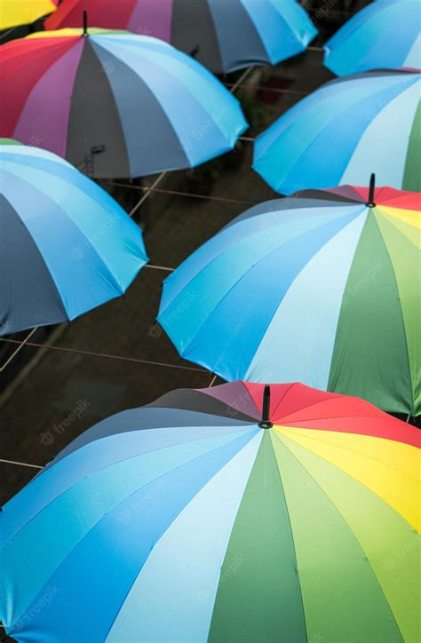 Premium Photo | Rainbow color umbrellas