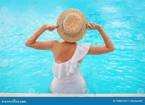 Beautiful Redhead Ginger Woman Sitting By The Swimming Pool In Summer