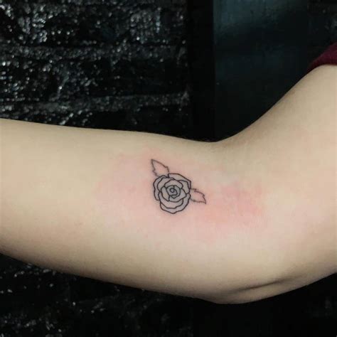 Minimalistic Style Rose Head Tattoo Located On The