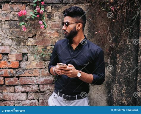 Handsome Indian Man Wearing A Black Shirt And Sunglasses And Holding A