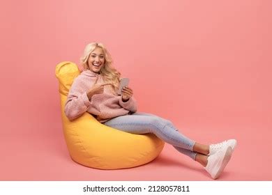 Mature Female Programmer Working Laptop Armchair Stock Photo
