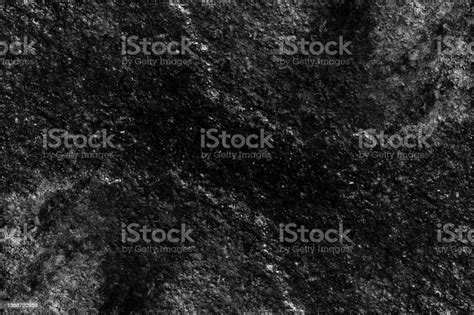 Rugged Old Stone Wall Surface With Heavy Grunge Texture Stock Photo