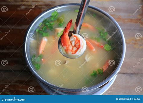 Spicy Shrimp Soup Or Tom Yum Goong Hot And Sour In Pot On Wood Table Thai Traditional Cuisine