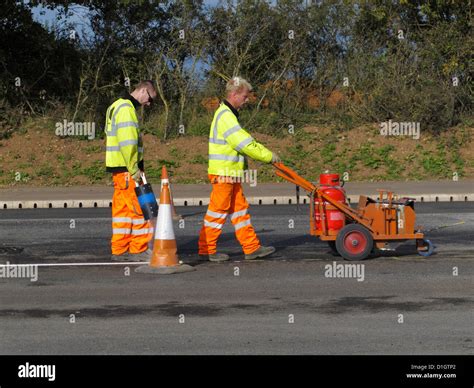 Road Marking Lining Gang Screeding White Lines On A Highway Uk Using