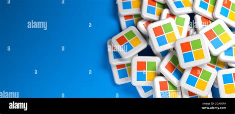 Logos of the tech company Microsoft on a heap. Web banner size with ...