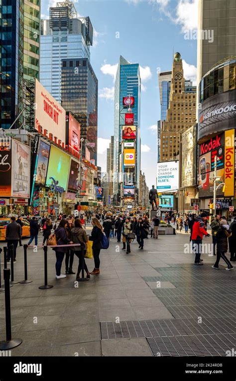 Crowded Time Square New York City With Lots Of People Standing And