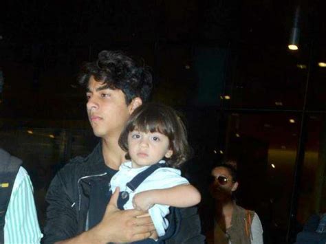 Photos Abram Khan And Aryan Khan Clicked At Airport Photos अबराम को संभालते बिग ब्रदर आर्यन