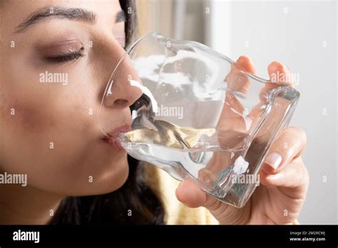 Drinking Water Close Up Cropped Image Of Thirsty Woman Drinking Water