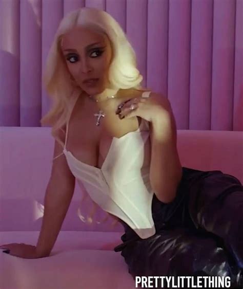 Doja Cat Goes Braless Under Plunging White Corset And Vinyl Baggy